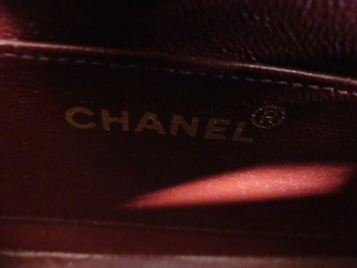 Lot 134 - Coco Chanel - a navy leather 'Madamoiselle'...