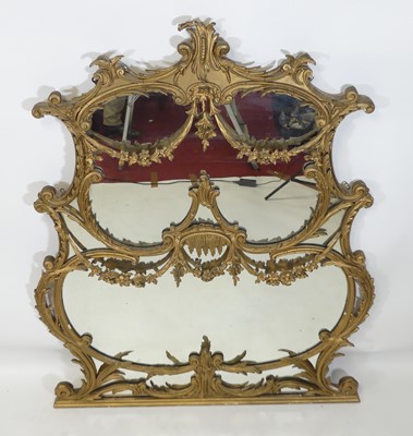 Lot 1373 - A Rococo Revival gilt composition overmantel...