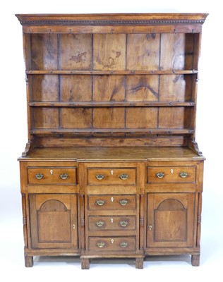 Lot 1386 - A George III fruitwood dresser, the upper...
