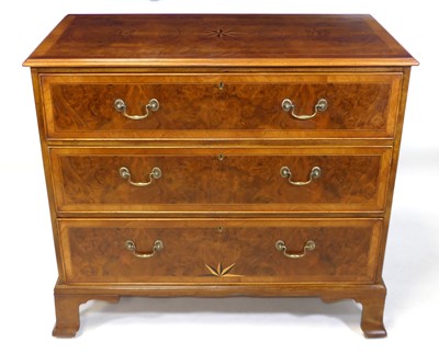 Lot 1410 - A walnut and figured walnut chest in the early...
