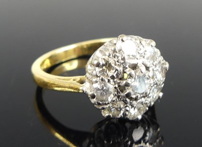 Lot 1182 - An 18ct yellow and white gold diamond circular...
