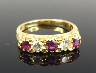 Lot 1188 - A yellow metal, ruby and diamond five-stone...