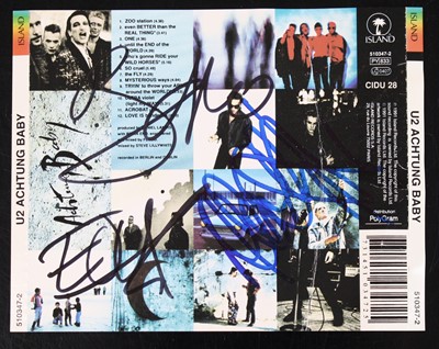 Lot 1165 - U2 - Achtung Baby CD sleve, signed in black...