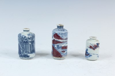 Lot 2002 - Three Chinese underglaze blue and red snuff...
