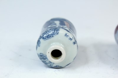 Lot 2002 - Three Chinese underglaze blue and red snuff...