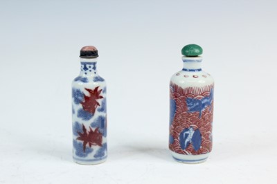 Lot 2006 - Two Chinese underglaze blue and red snuff...