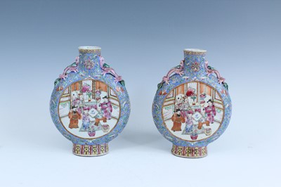 Lot 2143 - A pair of Chinese famille rose moon flasks,...