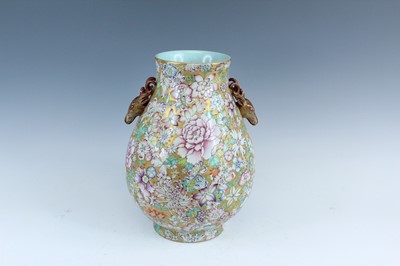 Lot 218 - A Chinese gilt-ground famille rose millefleurs...