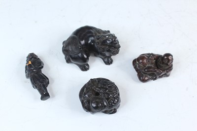 Lot 2234 - Four Japanese dark wood netsuke, Meiji era,...