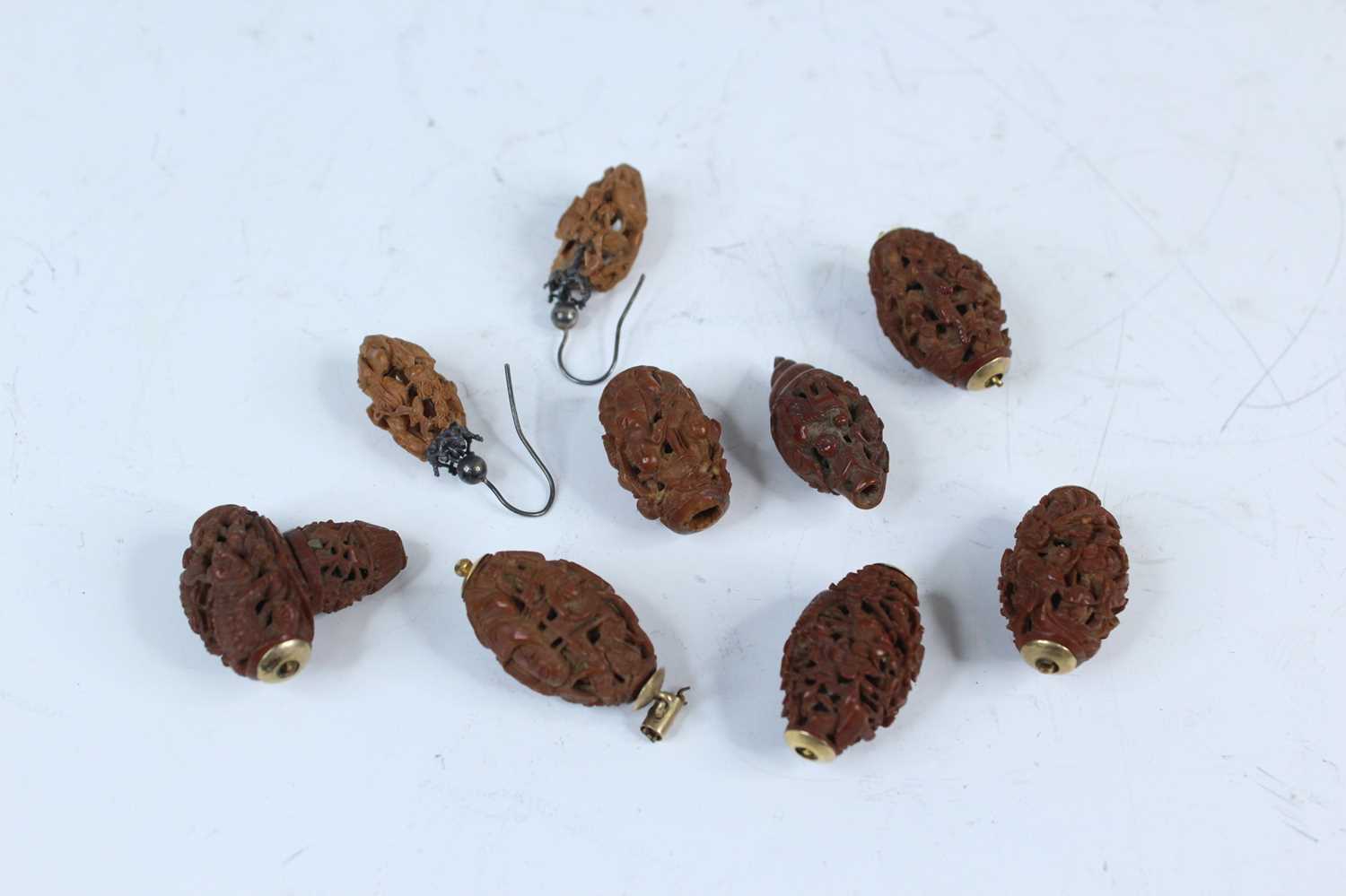 Lot 2052 - Nine Chinese olive pit carvings, Qing dynasty,...