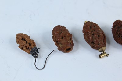 Lot 2052 - Nine Chinese olive pit carvings, Qing dynasty,...