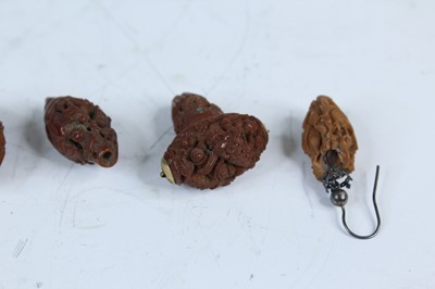 Lot 2052 - Nine Chinese olive pit carvings, Qing dynasty,...