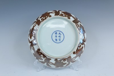 Lot 2155 - A Chinese iron-brown-decorated 'gardenia' dish,...