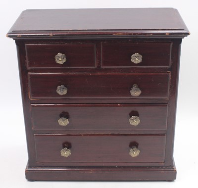 Lot 1658 - A stained pine circa 1920s miniature chest of...