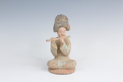 Lot 2100 - A Chinese painted earthenware figure of a lady,...