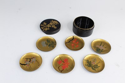 Lot 2266 - A Japanese lacquer set of six trays in a...
