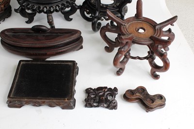 Lot 2095 - A collection of Chinese wooden stands and...