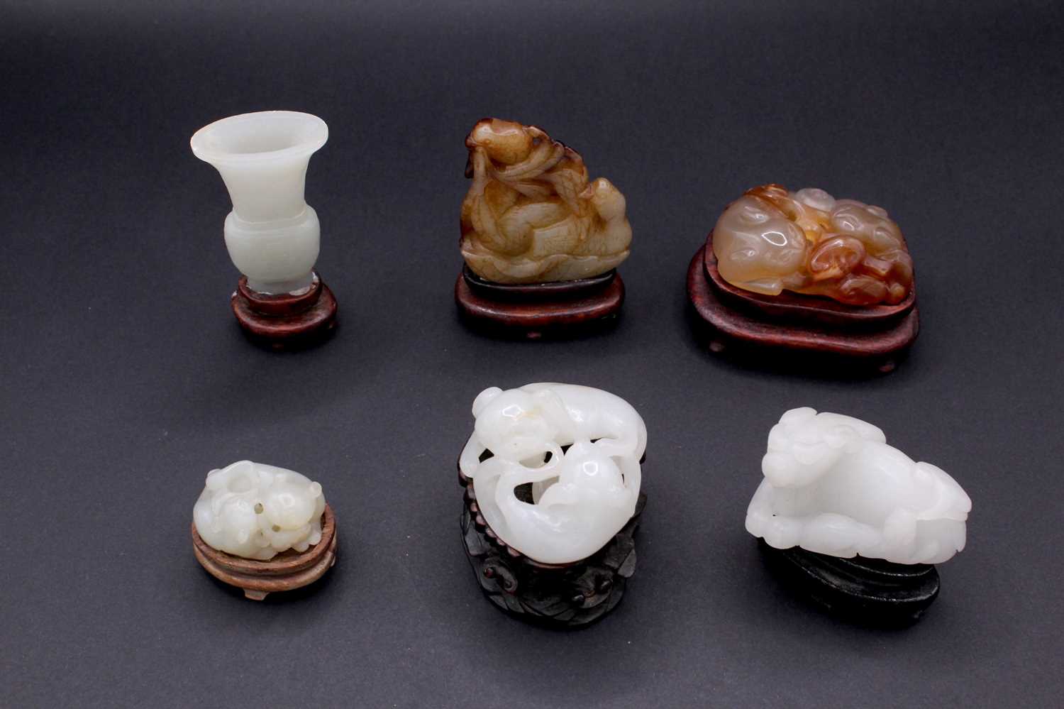 Lot 2048 - A group of six Chinese jade carvings, Qing...