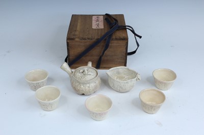 Lot 2249 - A set of Japanese stoneware tea wares, in the...