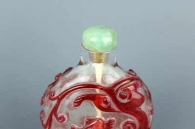 Lot 2010 - A Chinese red overlay transparent glass snuff...