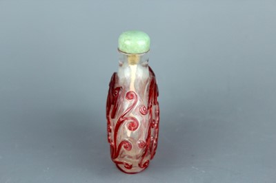 Lot 2010 - A Chinese red overlay transparent glass snuff...