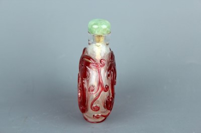 Lot 2010 - A Chinese red overlay transparent glass snuff...