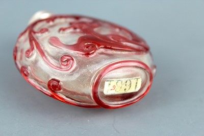 Lot 2010 - A Chinese red overlay transparent glass snuff...