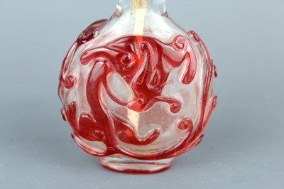 Lot 2010 - A Chinese red overlay transparent glass snuff...