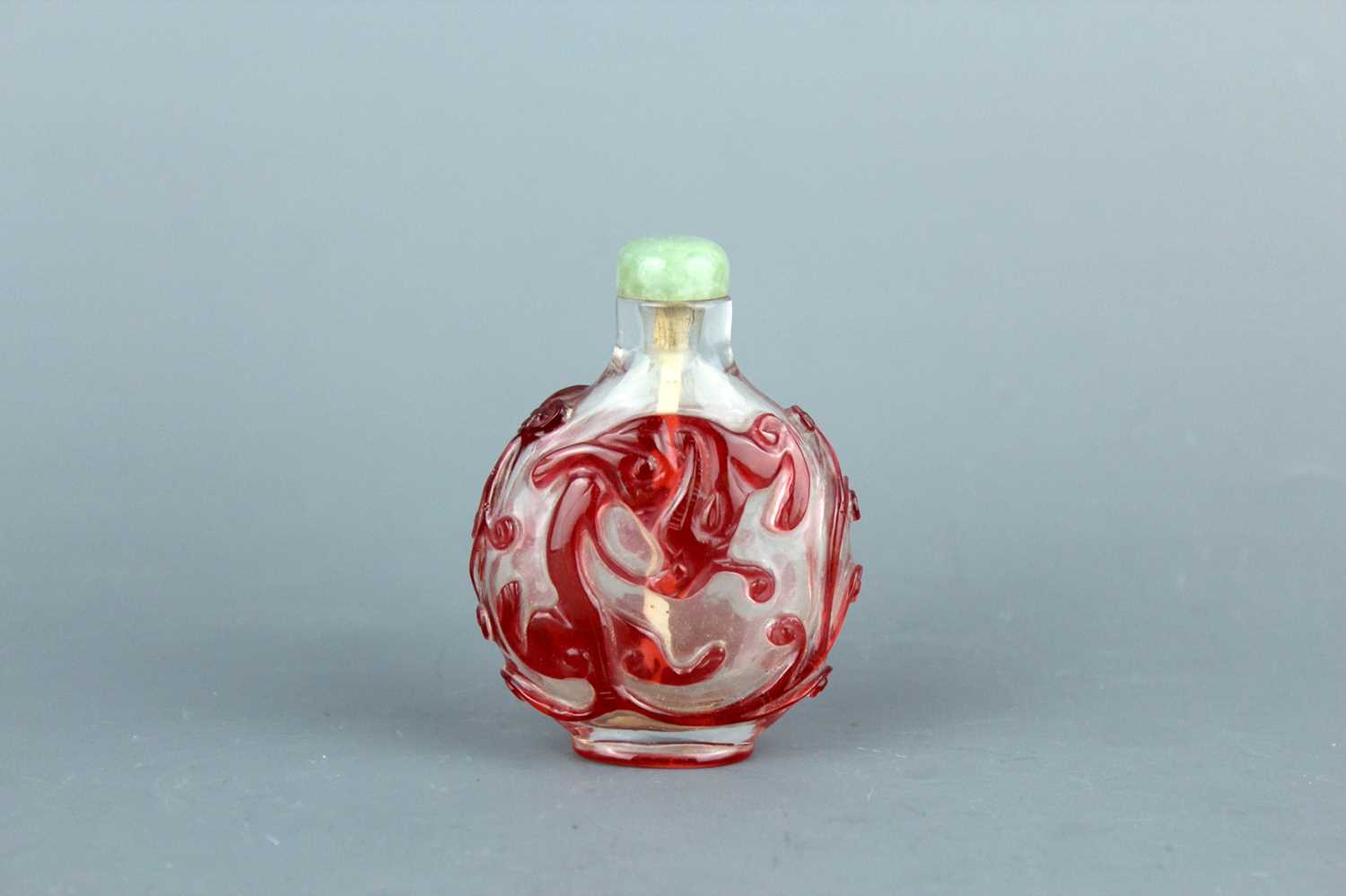 Lot 2010 - A Chinese red overlay transparent glass snuff...