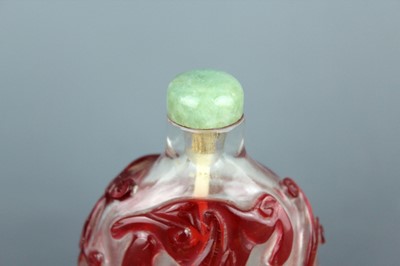 Lot 2010 - A Chinese red overlay transparent glass snuff...