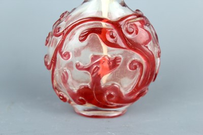 Lot 2010 - A Chinese red overlay transparent glass snuff...