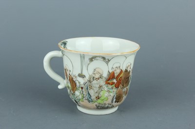 Lot 2255 - A small Japanese porcelain handled cup with...