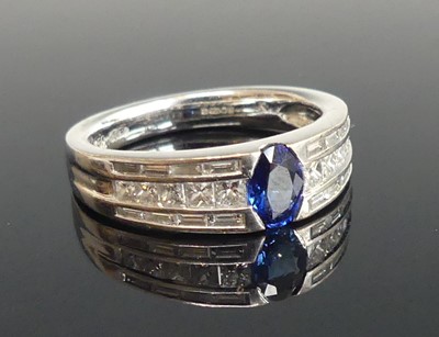 Lot 2511 - An 18ct white gold sapphire and diamond dress...