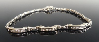 Lot 2118 - A white metal diamond bracelet, comprising...
