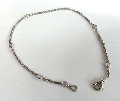 Lot 2119 - A white metal diamond bracelet, featuring six...
