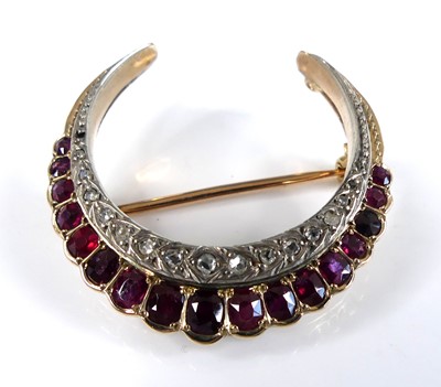 Lot 2573 - A yellow and white metal ruby and diamond...