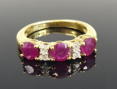 Lot 2574 - An 18ct yellow and white gold ruby and diamond...