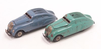 Lot 2008 - Two Schuco Kommando tinplate clockwork cars,...