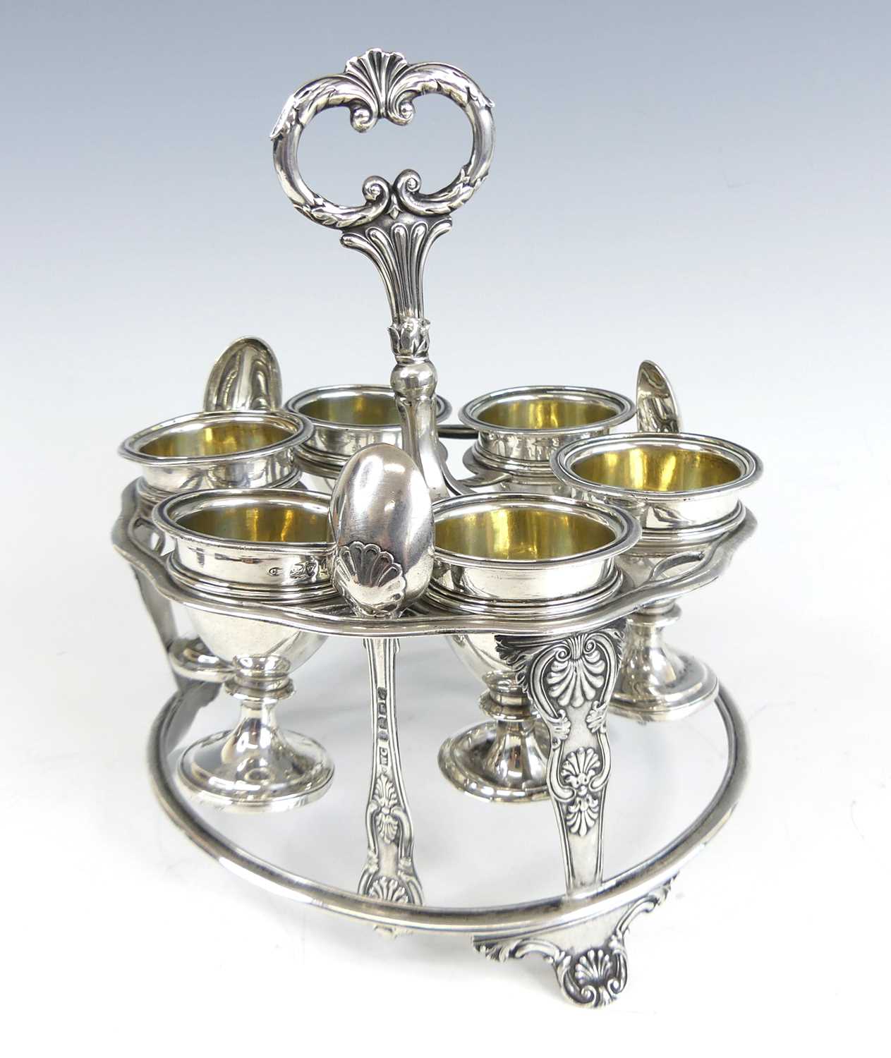 Lot 2077 - A George IV silver six-cup egg cruet, the...