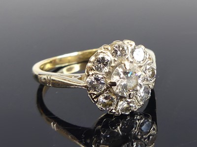 Lot 2565 - An 18ct yellow and white gold diamond circular...