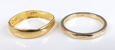 Lot 2569 - Two wedding bands, being a 22ct 4.5mm D-shaped...