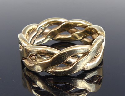 Lot 2587 - A 9ct yellow gold three-row twisted band ring,...