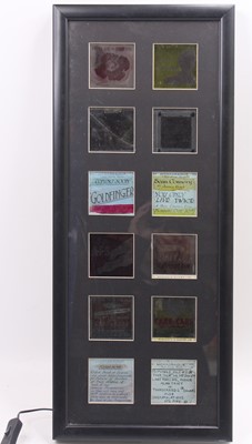 Lot 1339 - A framed & glazed collection of 12 cinema film...