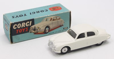 Lot 1221 - Corgi Toys No.208 Jaguar 2.4 in a white body...