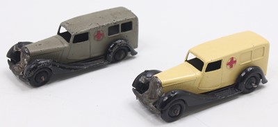 Lot 1126 - 2 Dinky Toys No.30F Ambulances, one in cream...
