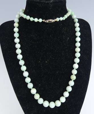 Lot 2637 - A beaded jadite necklace, comprising...
