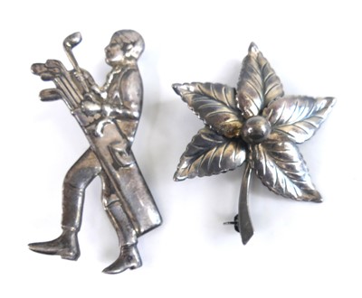 Lot 2625 - A sterling silver brooch fashioned as a golfer...