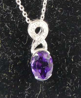 Lot 2609 - An 18ct white gold amethyst and diamond...