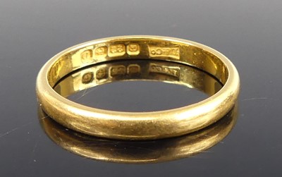 Lot 2543 - A 22ct gold court shaped wedding band, sponsor...