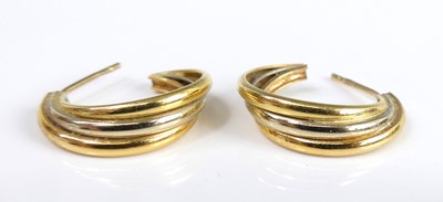 Lot 2547 - A pair of modern 18ct three-colour gold hoop...